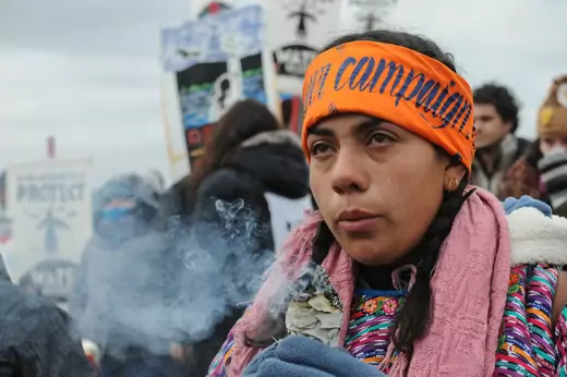 A protester cries while watching a demonstration on Turtle Island on Thanksgiving day during a protest against plans to pass the Dakota Access pipeline near the Standing Rock Indian Reservation, near Cannon Ball, North Dakota.