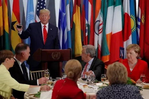 U.S. President Donald Trump toasts during a luncheon hosted by United Nations Secretary General Antonio Guterres (C) for world leaders.
