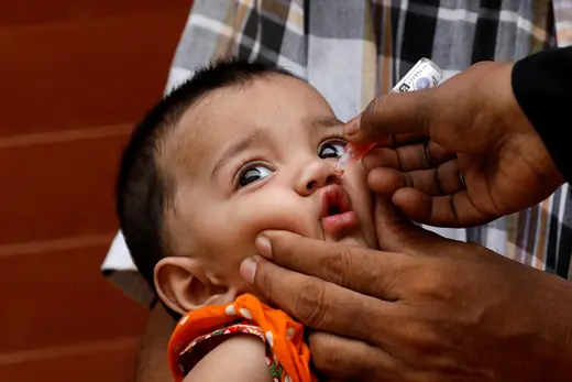 A child receives polio vaccine drops in an anti-polio campaign in Karachi, Pakistan.