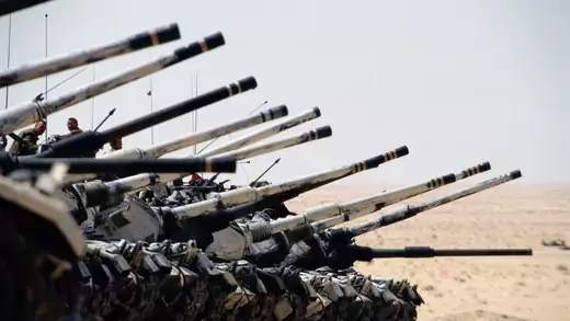 A line of tanks advances in the Saudi desert