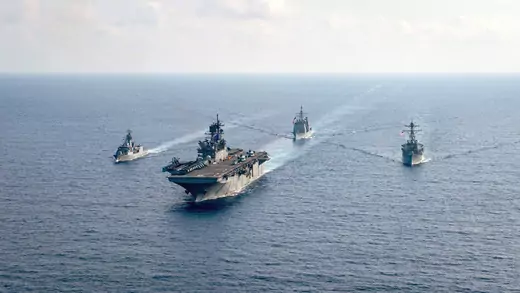 The Royal Australian Navy guided-missile frigate HMAS Parramatta (L) is underway with the U.S. Navy amphibious assault ship USS America, the Ticonderoga-class guided-missile cruiser USS Bunker Hill, and the Arleigh-Burke-class guided-missile destroyer USS Barry in the South China Sea on April 18, 2020. 