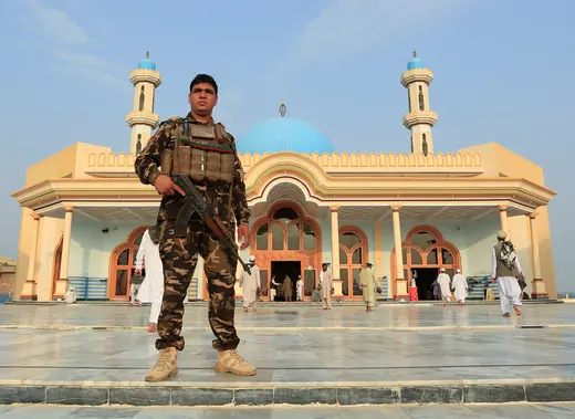 A member of the Afghan security forces stands guard outside a mosque in Jalalabad, Afghanistan, on July 31, 2020.