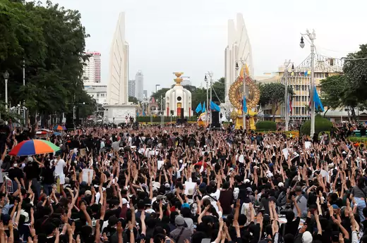 Pro-democracy protesters raise their hands in a three-fingered salute during a rally to demand the government to resign, to dissolve the parliament and to hold new elections under a revised constitution, near the Democracy Monument in Bangkok, Thailand on August 16, 2020.