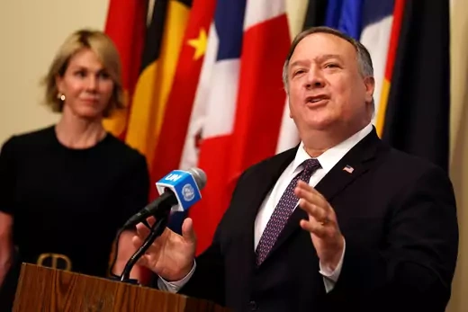 Ambassador Kelly Craft watches Secretary of State Mike Pompeo talk about the nuclear deal after a UN Security Council meeting