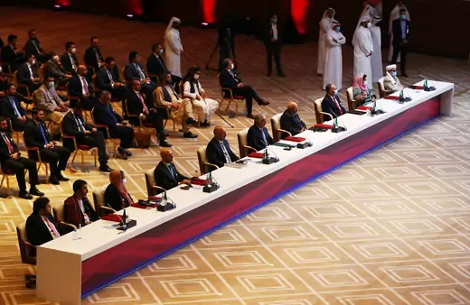 Delegates are seen before talks begin between the Afghan government and the Taliban in Doha, Qatar, on September 12, 2020. 