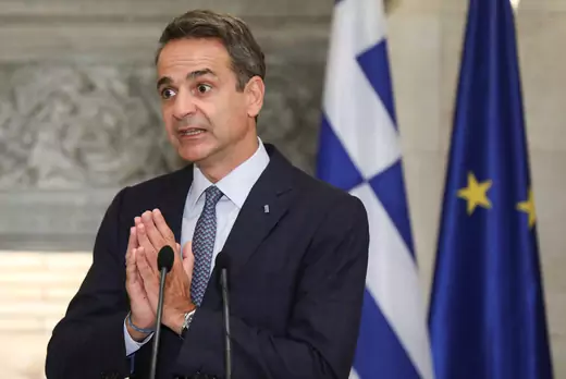 Greek Prime Minister Kyriakos Mitsotakis gestures during a news conference with European Council President Charles Michel.