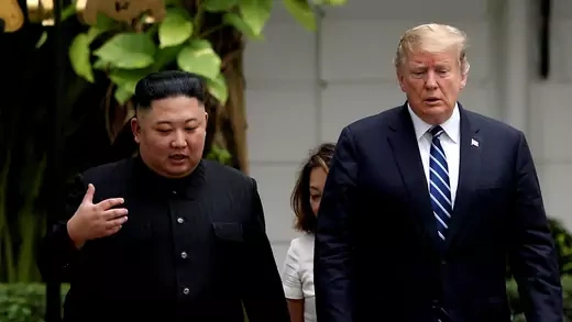 North Korea's leader Kim Jong Un and U.S. President Donald Trump walking side by side.
