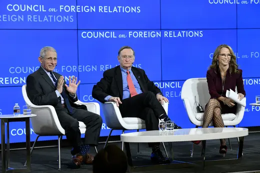 Anthony Fauci, Robert P. Kadlec, and Frances Fragos Townsend sit in white chairs behind a low white coffee table against a blue Council on Foreign Relations background