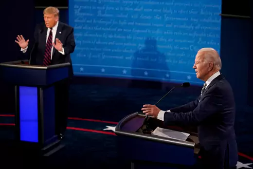 Vice President Biden and President Trump, both standing behind podiums, gesticulate towards the moderator during the first 2020 presidential debate.