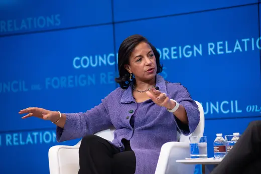Susan E. Rice, in a purple jacket and black pants, sits in a white chair in front of a blue Council on Foreign Relations background