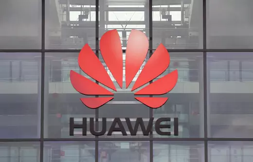 Huawei logo is pictured on the headquarters building in Reading.
