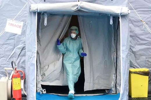 A medical worker wearing protective mask is seen at a medical checkpoint at the entrance of the Spedali Civili hospital in Brescia, Italy on March 3, 2020. 
