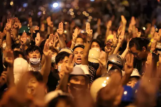 People show the three-fingered salute during a protest, in Bangkok, Thailand on October 26, 2020.