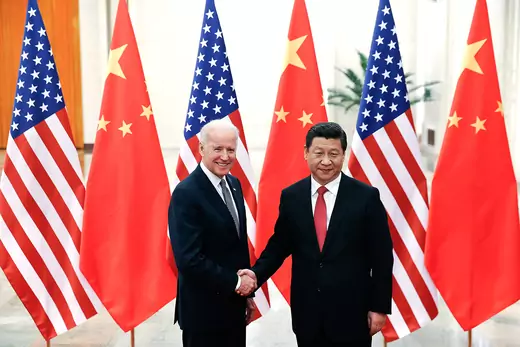 Chinese President Xi Jinping (R) shake hands with U.S Vice President Joe Biden (L) inside the Great Hall of the People on December 4, 2013 in Beijing, China.