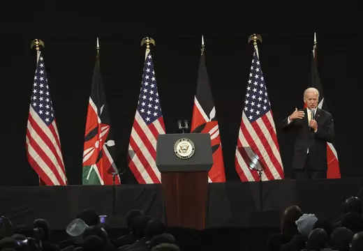 U.S. Vice President Joe Biden addresses a public forum at the Kenyatta International Conference Centre in the Kenyan capital Nairobi. American and Kenyan flags can be seen in the background. A podium with the seal of the U.S. Vice President can be seen in the middle of the picture.