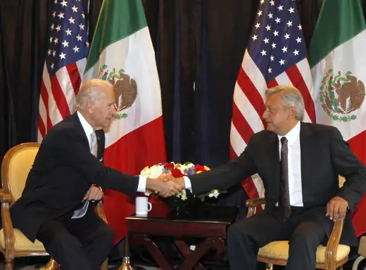 U.S. Vice President Joseph Biden (L) shakes hands with Andres Manuel Lopez Obrador, presidential candidate for the Party of the Democratic Revolution (PRD) during a photo opportunity in Mexico City March 5, 2012. 