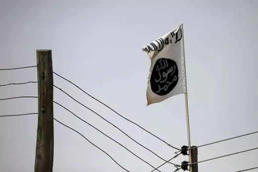 A flag of Boko Haram, a terrorist group operating in northwest Nigeria, is seen attached to an electrical pole.