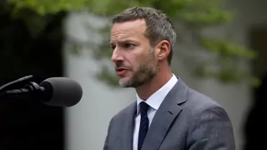 Adam Boehler speaks into a microphone during a coronavirus briefing at the White House