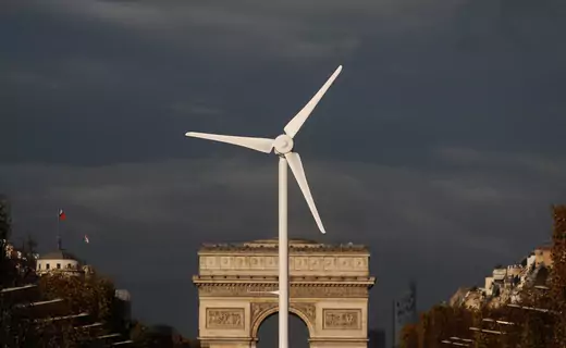 A power-generating windmill turbine is seen in front of the Arc de Triomphe on the Champs Elysees avenue in Paris ahead of the COP21 World Climate Summit, France, November 25, 2015.