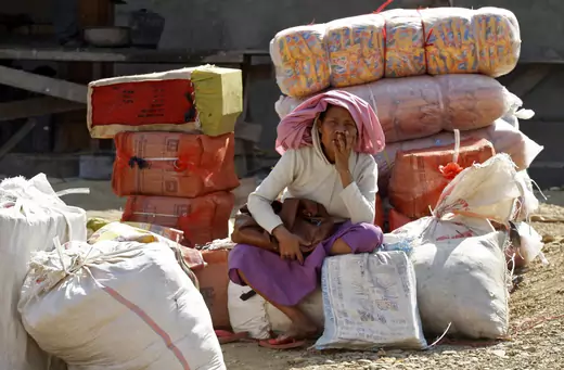 Woman sits in Myanmar. Radik De Chowdhuri/REUTERS