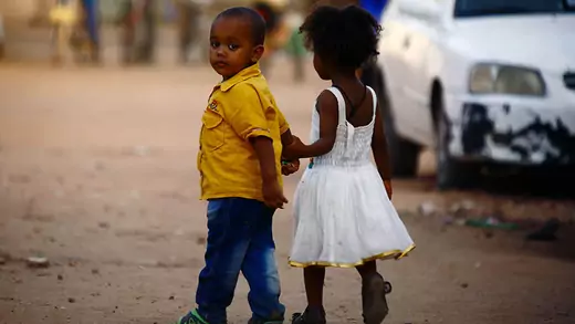 Sudanese children walk on a street on July 6, 2016 in eastern Khartoum