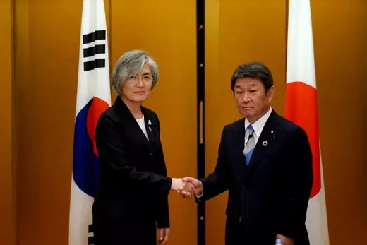 Japan's Foreign Minister Toshimitsu Motegi shakes hands with South Korea's Foreign Minister Kang Kyung-wha before the G20 foreign ministers meeting in Nagoya, Japan, on November 23, 2019. 