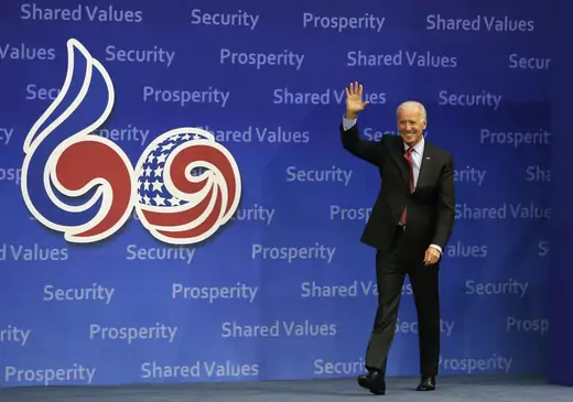 U.S. Vice President Joe Biden waves upon his arrival at Yonsei University in Seoul on December 6, 2013. 