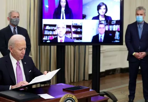 U.S. President Joe Biden signs an executive order.