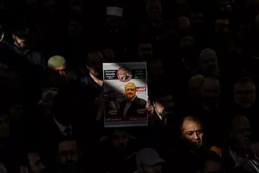 A person holds a banner of Jamal Khashoggi during a symbolic funeral prayer for the Saudi journalist, killed and dismembered in the Saudi consulate in Istanbul in October, at the courtyard of Fatih mosque in Istanbul, on November 16, 2018.