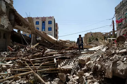 A Yemeni man inspects a house that was destroyed in an airstrike carried out during the war by the Saudi-led coalition's warplanes, on February 05, 2021 in Sana'a, Yemen.