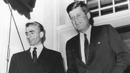 Black and white photo of President Kennedy with the Shah of Iran at the White House in 1962. 