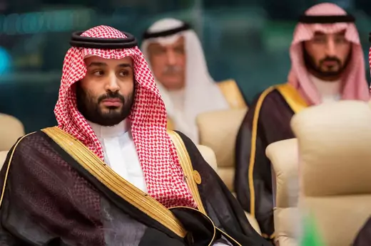 Saudi Crown Prince Mohammed bin Salman is pictured with two other Saudi officials seated behind him