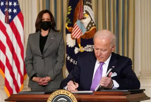 Vice President Kamala Harris looks on as President Joe Biden signs executive orders addressing racial equality. Kevin Lamarque/REUTERS 