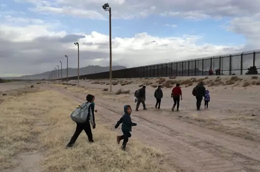  Central American immigrants approach the U.S.-Mexico border fence after crossing the Rio Grande from Mexico on February 01, 2019 in El Paso, Texas. They later turned themselves in to U.S. Border Patrol agents, seeking political asylum in the United States.