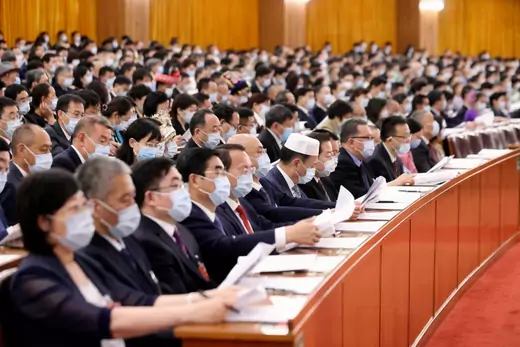 Deputies wearing face masks attend the second plenary meeting of the third session of the 13th National People's Congress (NPC) at the Great Hall of the People on May 25, 2020 in Beijing, China.