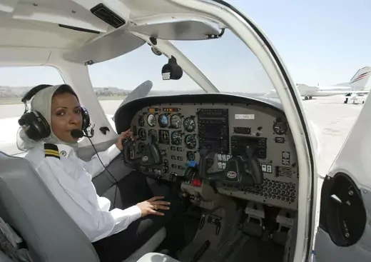 Hanadi Hindi, first female pilot from Saudi Arabia, sits in the cockpit of a plane prior to takeoff in Amman, Jordan in 2003. 
