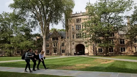 Students walking on university campus.
