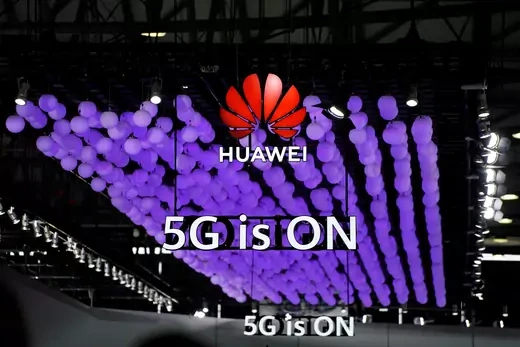 A Huawei logo and a 5G sign are pictured at Mobile World Congress (MWC) in Shanghai.