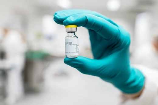 A lab worker holds a vial of Johnson & Johnson's Janssen coronavirus disease (COVID-19) vaccine candidate.