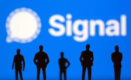 Small toy figures are seen in front of Signal logo.