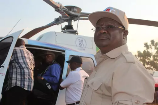 Tanzanian opposition leader Tundu Lissu prepares to board a helicopter.