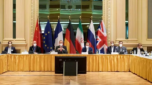 Foreign ministers from China, EU, France, Germany, Iran, Russia, and UK sit at a table in front of their countries' flags
