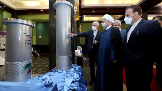 Iranian President Hassan Rouhani and other men view centrifuges at a nuclear plant in Tehran.