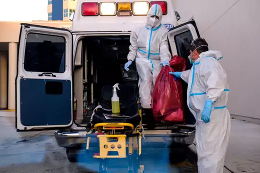 FILE PHOTO: EMTs cleanse their materials outside Memorial West Hospital where coronavirus disease (COVID-19) patients are treated, in Pembroke Pines, Florida, U.S. July 13, 2020. REUTERS/Maria Alejandra Cardona/File Photo - RC2RYH9MZFI5
