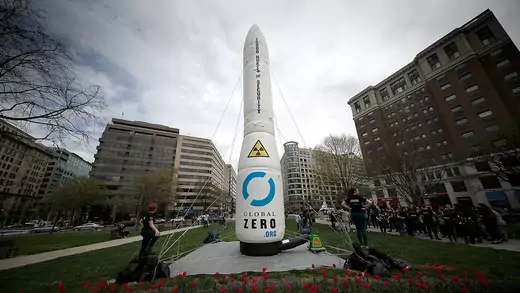 An inflatable nuclear missile balloon stands at the ready before a protest held by the group Global Zero in McPherson Square in Washington, DC.