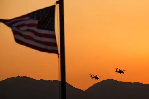 Two UH-60 Blackhawk helicopters depart forward operating base Gamberi in the Laghman province of Afghanistan December 25, 2014.
