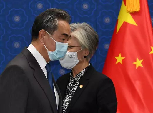 Chinese Foreign Minister Wang Yi (L) and South Korean Foreign Minister Kang Kyung-wha (R) prior to their meeting at the foreign ministry in Seoul, South Korea, November 26, 2020.