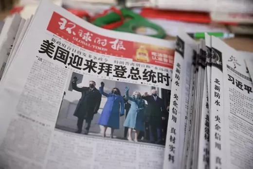 A copy of the Global Times newspaper featuring an image of U.S. President Joe Biden and Vice President Kamala Harris on its front page is seen at a news stand in Beijing, China January 21, 2021.