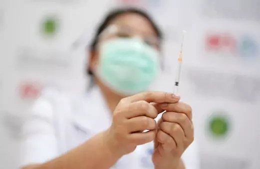 A healthcare worker prepares a syringe with a dose of Sinovac's COVID-19 vaccine at the Bang Khun Thian Geriatric Hospital in Bangkok, Thailand April 21, 2021.