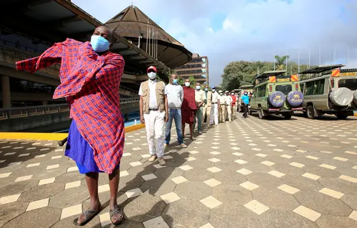 Kenyan tour guides and travel operators queue to receive the AstraZeneca/Oxford vaccine against the coronavirus disease (COVID-19), under the COVAX scheme, in Nairobi, Kenya, April 27, 2021